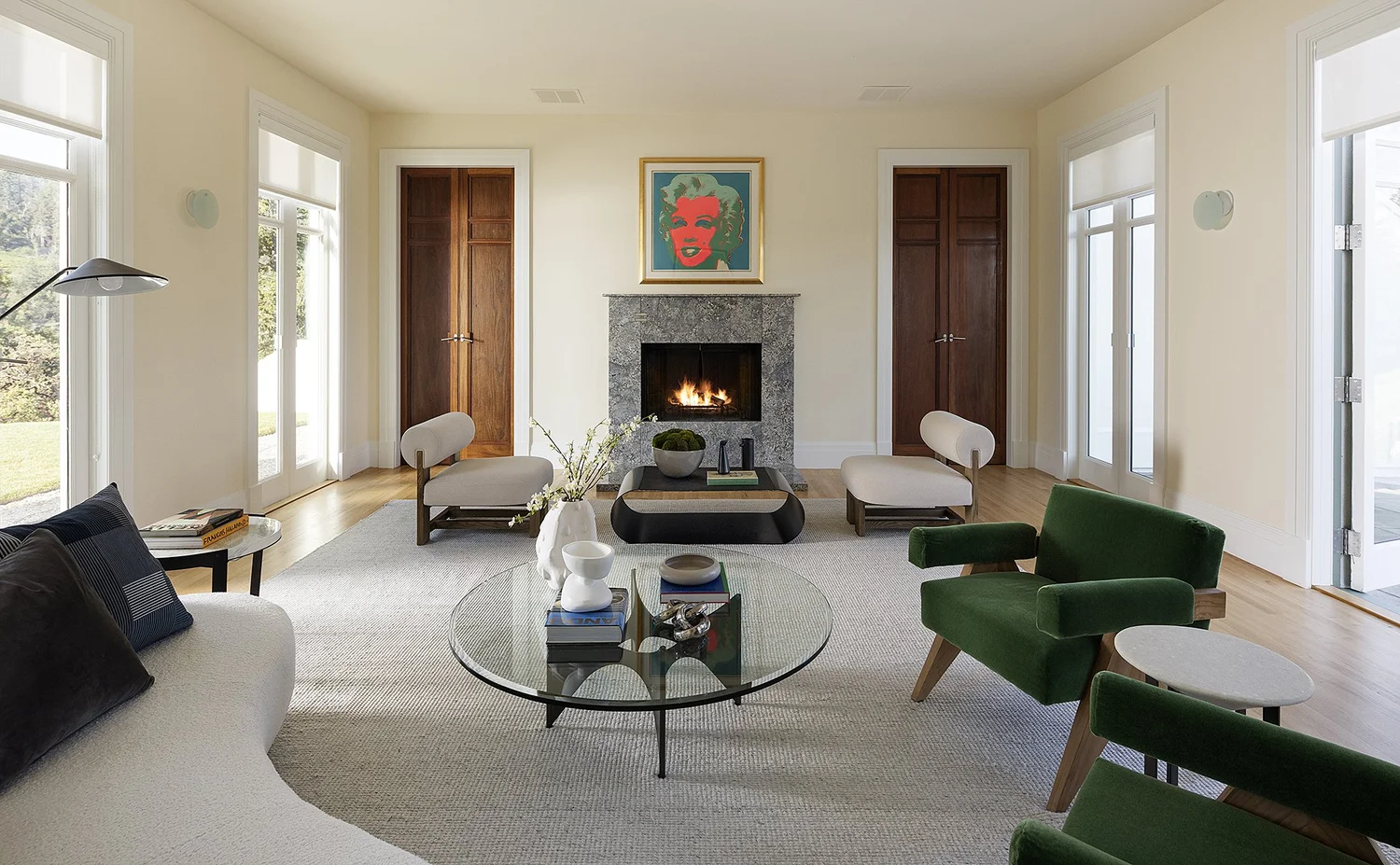 Tall interior doors opening to a tower and lawn terrace