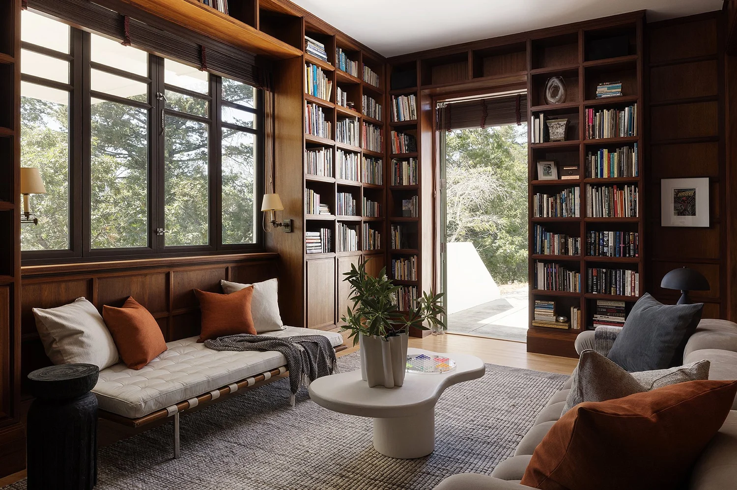 Elegant lounge with fireplace, art, and contemporary seating